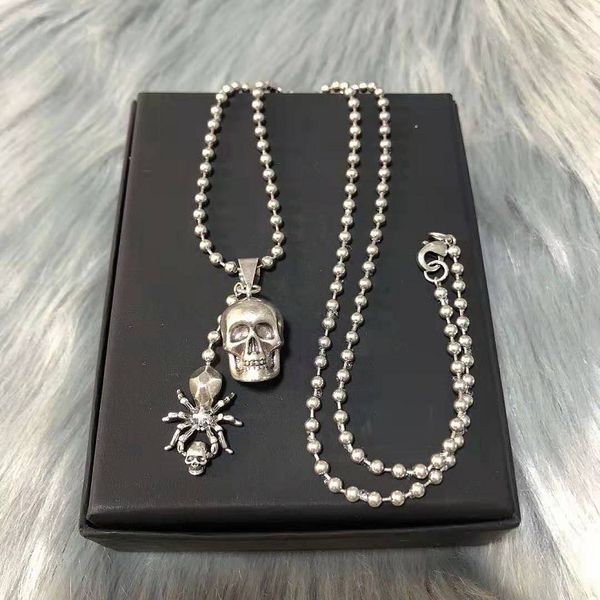 Elegant 14k gold women's necklace featuring a spider skeleton and Buddha bead design, perfect for weddings or stylish sweater chains