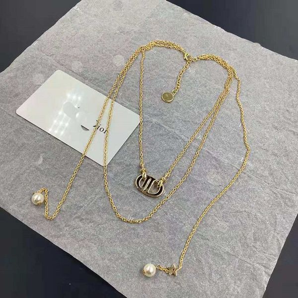 Elegant 14k gold women's necklace featuring pearls, perfect for weddings or adding a fashionable touch to any outfit