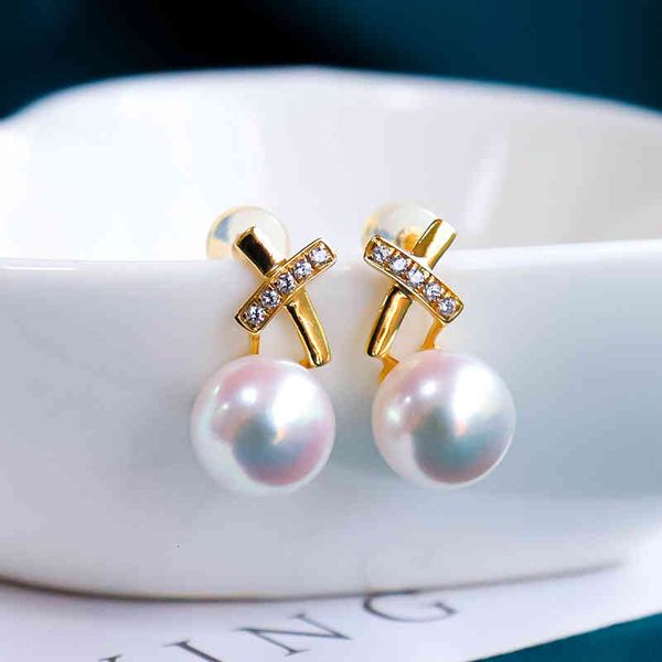 Elegant 18k gold earrings featuring zircon crosses, pearls, jade, and decorative beads for women