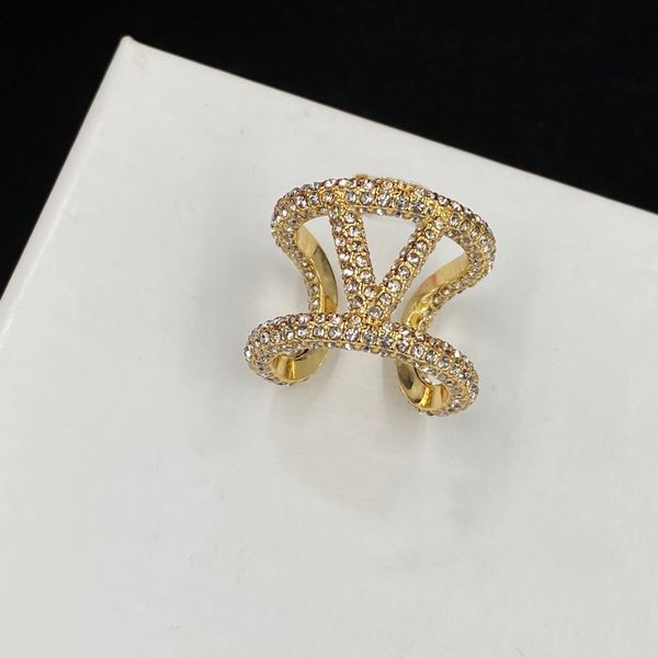 Elegant 18K gold women's ring featuring a heart design with pearls, crystals, and double V letter accents in luxurious gold studded style