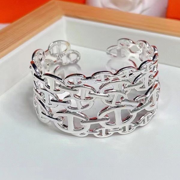 Elegant 18K gold-plated bangle set for women featuring simple letter designs and a secure latch