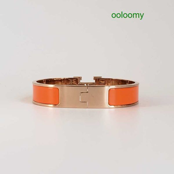 Elegant 18k rose gold enamel bracelet for women, featuring a 12mm wide steel bangle cuff with a luxurious gift bag
