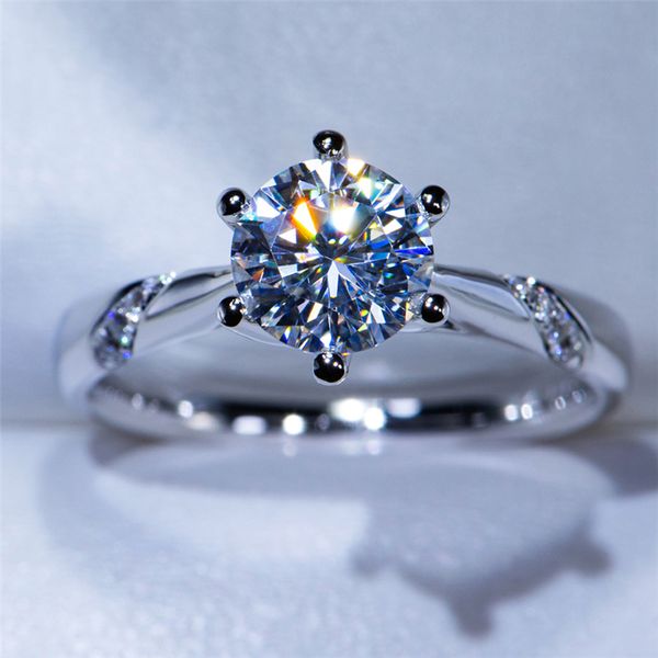 Elegant 18K white gold wedding rings featuring 1ct, 2ct, or 3ct round brilliant cut diamonds in a single row setting, perfect for engagement or anniversary gifts for women