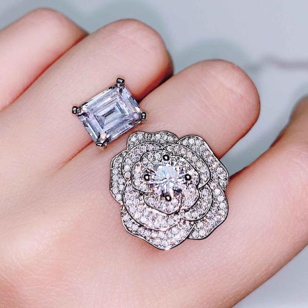Elegant 925 silver camellia ring with transparent cubic zirconia, perfect for bridal engagement and adjustable sizing