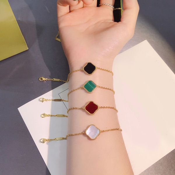 Elegant bangle bracelet with a delicate clover stone design, perfect for weddings and women's jewelry