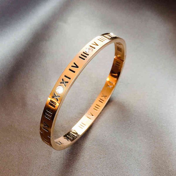 Elegant bangle bracelets with a luxurious, ethnic-inspired design featuring Roman numerals on a titanium steel mesh band in red