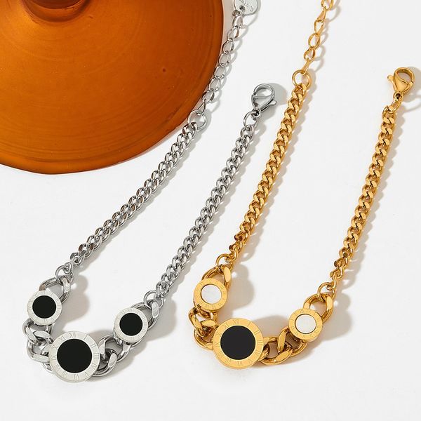 Elegant brass bracelet featuring round Roman numeral charms, perfect for gifting