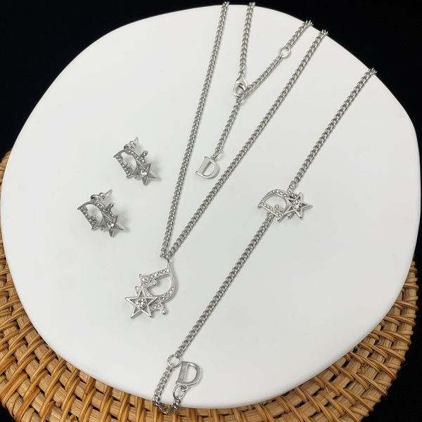 Elegant brass diamond jewelry set for women, featuring trendy letter earrings and a chic bracelet necklace combo from Di 2021's d Family collection