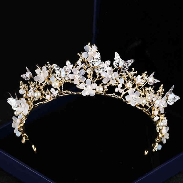 Elegant bridal hair accessories featuring butterfly and floral crystal crowns with golden baroque headdresses