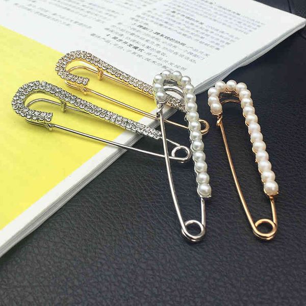 Elegant brooch jewelry featuring pearls and rhinestones, designed for high-quality silk scarves and dress accessories