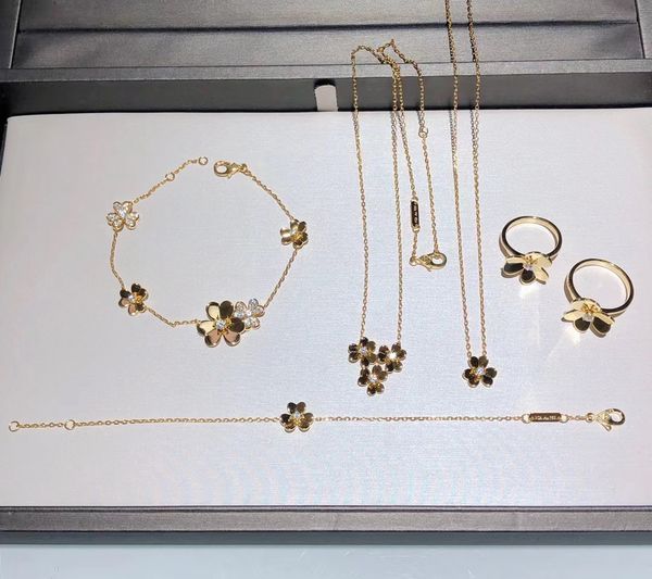 Elegant butterfly-themed jewelry set including bracelet, necklace, and earrings with special wedding design, presented in a gift box