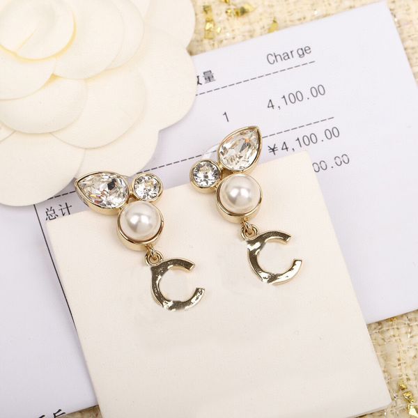Elegant crystal and shell bead drop earrings with luxurious charm, perfect for women's weddings or as a gift, presented in a stamped PS7526 box