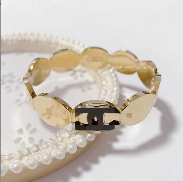 Elegant designer charm bracelet for women, crafted in plated stainless steel with 18K gold finish, perfect for parties and gifting