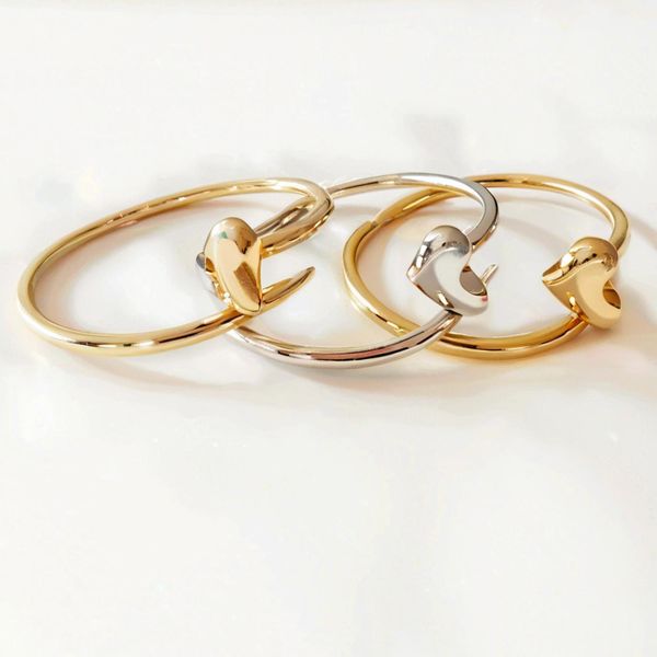 Elegant designer jewelry bangle in 18K rose gold and silver stainless steel with diamonds, unisex tennis bracelet