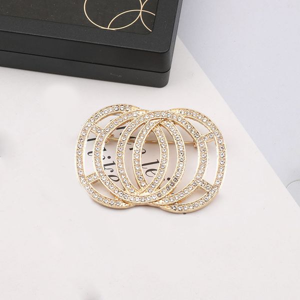Elegant designer letter brooches with gold and silver accents, featuring luxurious floral designs and sparkling rhinestones for stylish women's fashion accessories