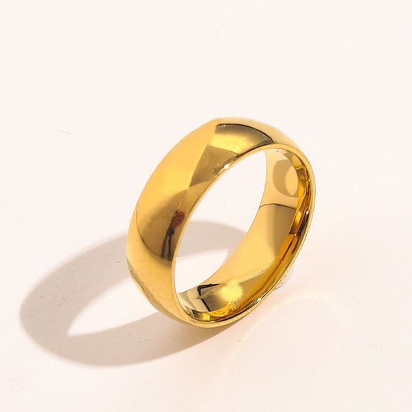 Elegant designer rings for women featuring love charms, wedding bands, and 18K gold-plated stainless steel with embossed detailing
