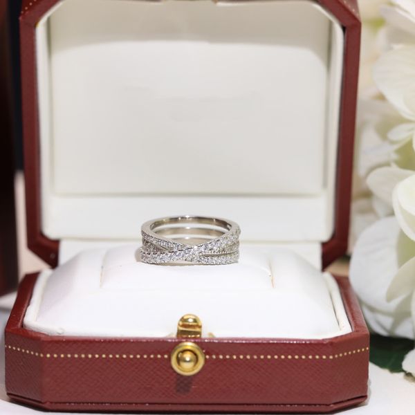 Elegant designer rings for women featuring pearl inlays, alphabet diamond patterns, and versatile styling, perfect as Christmas gifts