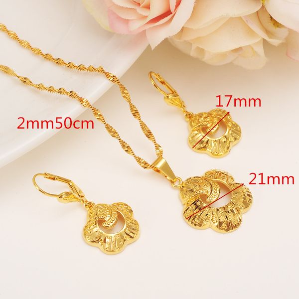 Elegant Ethiopian-inspired 9k gold jewelry set featuring necklace, pendant, and earrings for fashionable party wear