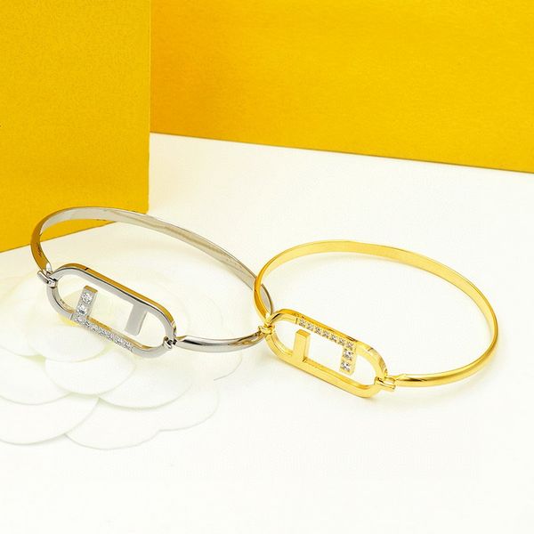 Elegant European and American designer jewelry for women featuring a hollow-out engraved 18K gold and diamond bangle bracelet in two color options