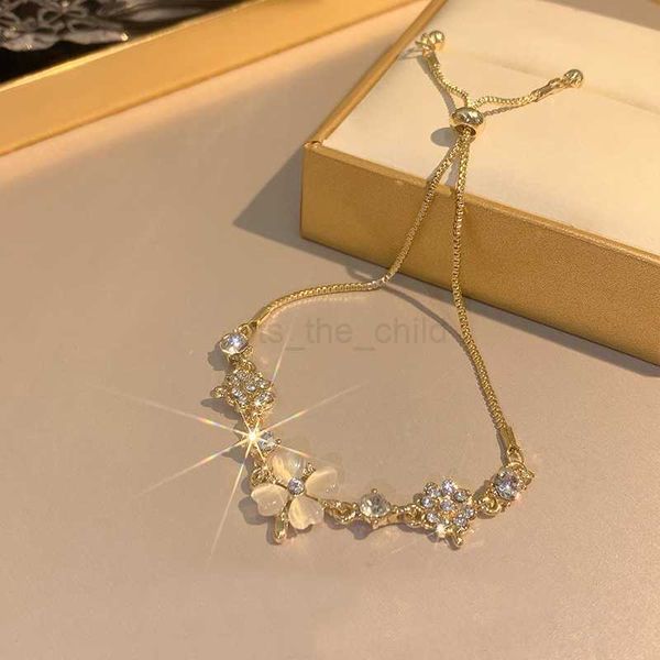 Elegant four-leaf clover gold-tone charm bracelets for women, adjustable Korean-style jewelry perfect for weddings and parties