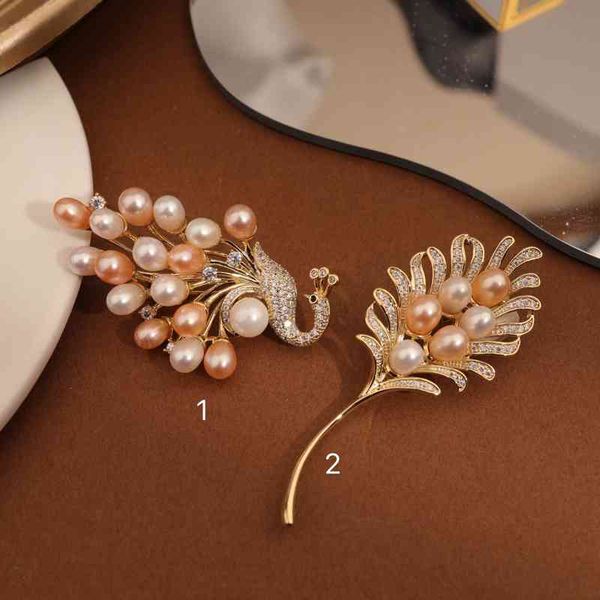 Elegant freshwater pearl brooch with intricate minority-inspired micro inlay design, perfect for enhancing cashmere coats