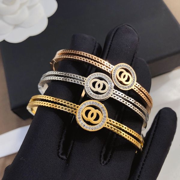 Elegant geometric bangle bracelet with round letter charms, luxurious stainless steel inlay and sparkling crystals for women, a stylish non-fading cuff wristband