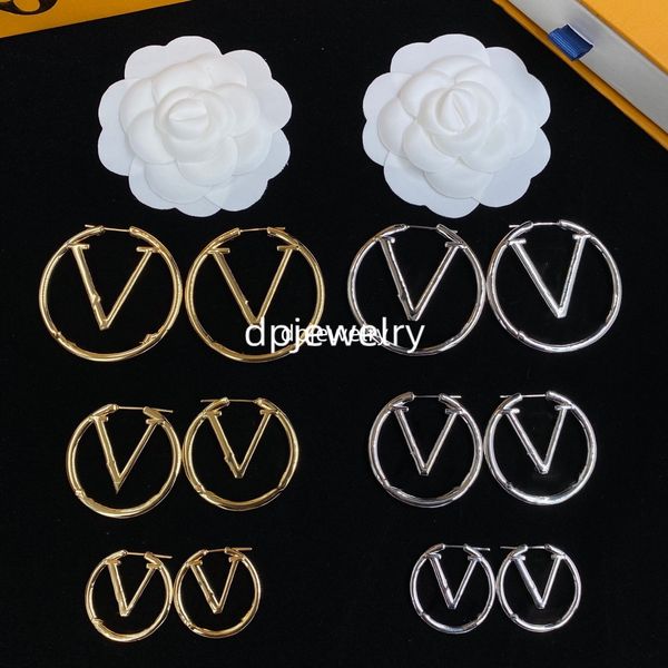 Elegant gold and silver jewelry set for women featuring designer earrings, necklace, and bracelet with letter pendant and clover charm, perfect for weddings and special occasions