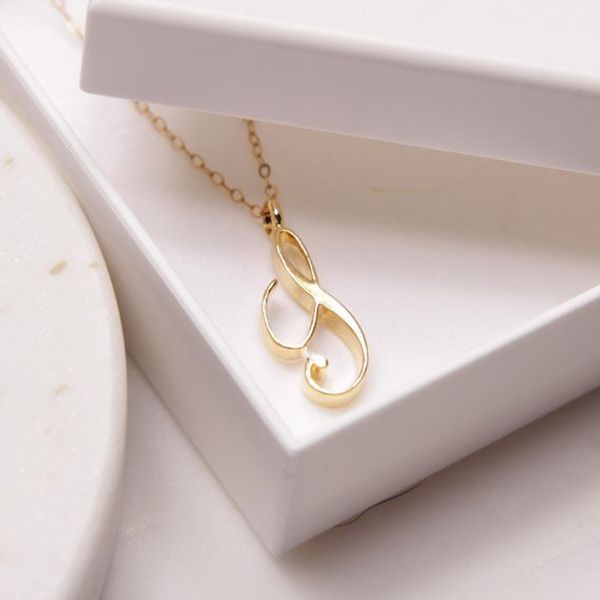 Elegant gold and silver plated initial necklaces featuring all 26 cursive alphabet letters for personalized monogram jewelry