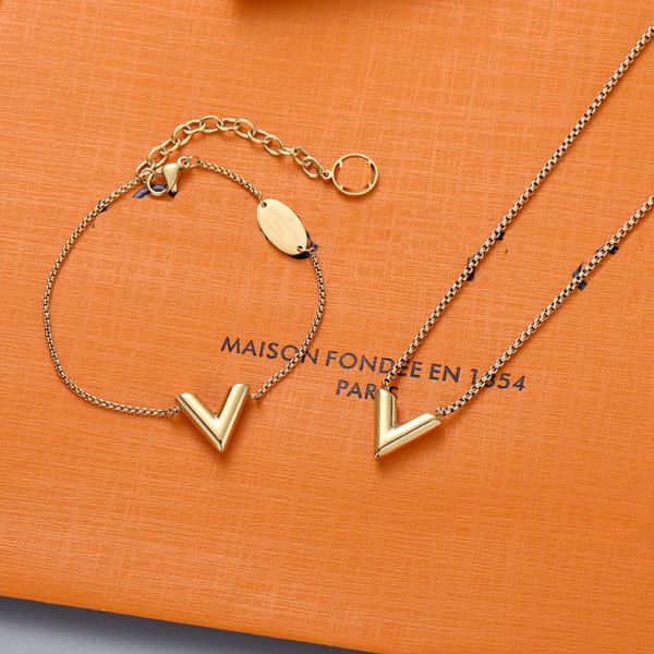 Elegant gold-plated pendant charm bracelet featuring a love heart design and stylish V-necklace