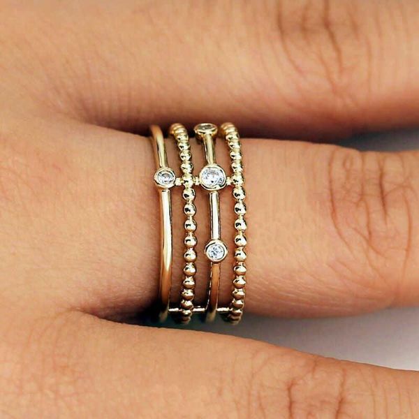 Elegant gold-toned wedding ring set with geometric design, handcrafted for women as stylish jewelry gifts
