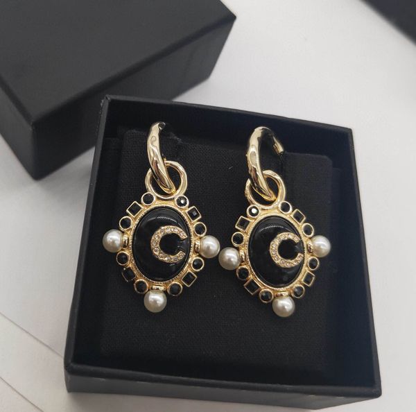 Elegant oval drop earrings featuring black agate beads and diamonds in 18k gold plating, perfect for women's wedding jewelry or gifts