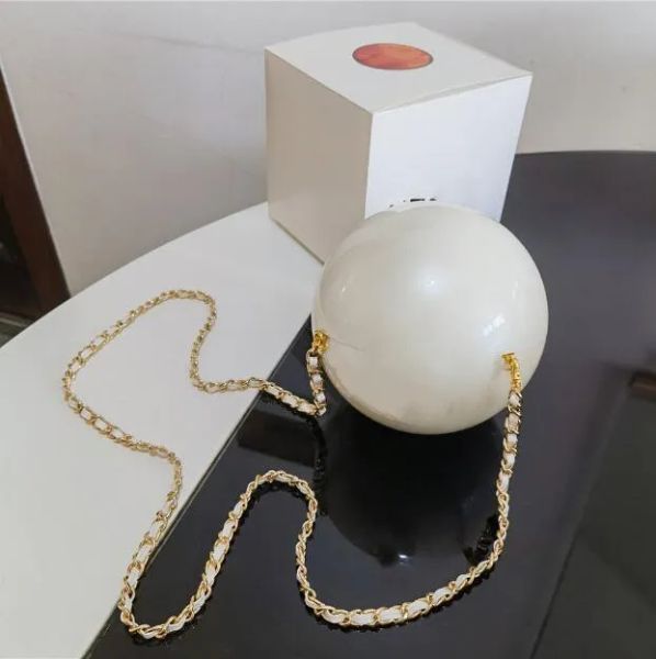 Elegant Parisian designer jewelry pouches featuring pearl balls, stylish storage bags for Coco Girls, includes bracelet and shoulder strap