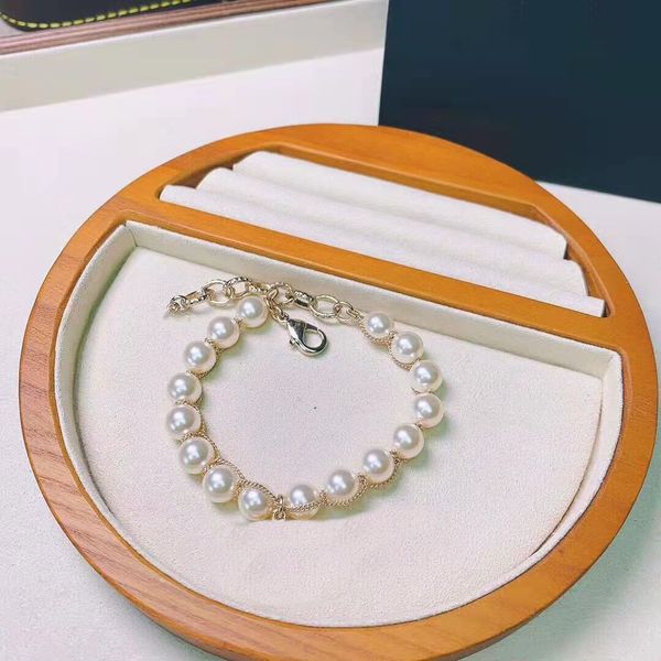 Elegant pearl bracelet set for women featuring square diamond charms in gold electroplated finish