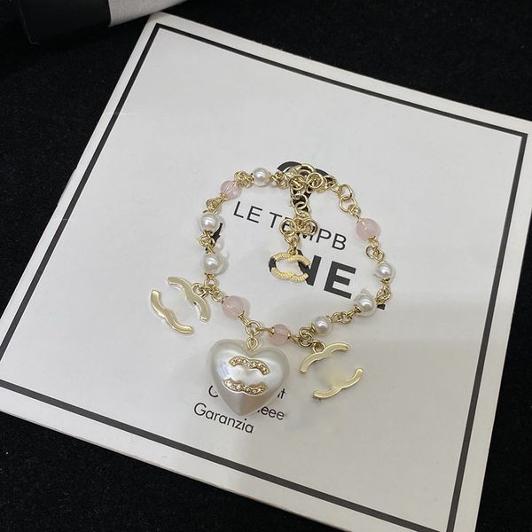 Elegant pearl heart charms for women, stylish bracelet pendant, premium classic jewelry gift with timeless appeal