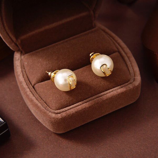 Elegant pearl stud earrings with a stylish V-logo design for fashionable women