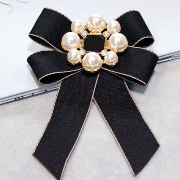 Elegant pearl-adorned bow brooch for stylish women's fashion accessories