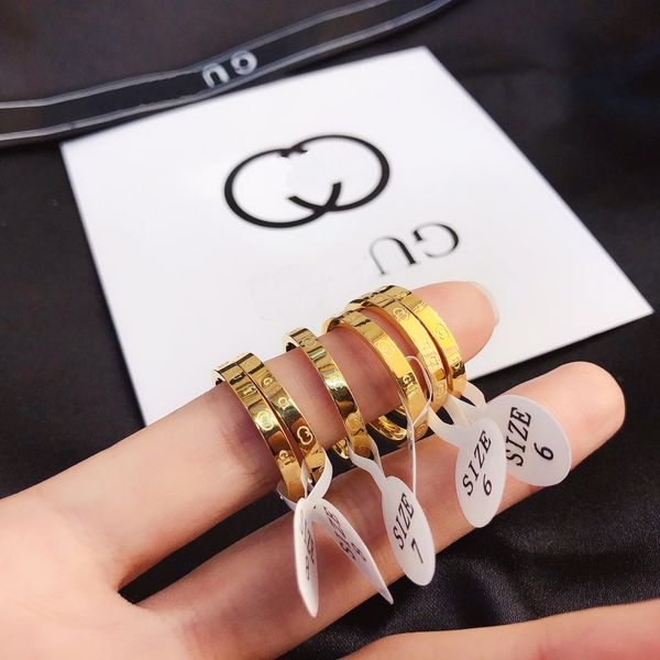 Elegant premium wedding band for women, stylish designer letter ring in 18k gold plating, a chic jewelry accessory