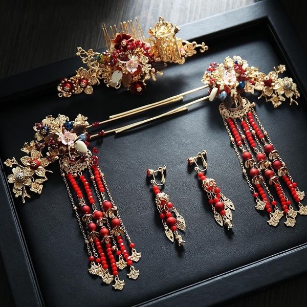 Elegant red Chinese bridal hairpins with long beads, combs, and earrings for a simple yet stunning wedding look
