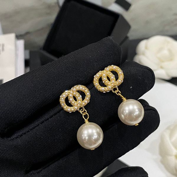 Elegant round pearl letter earrings by Charm Top Designers, crafted from premium copper brass with 18K gold plating for lasting luxury and love