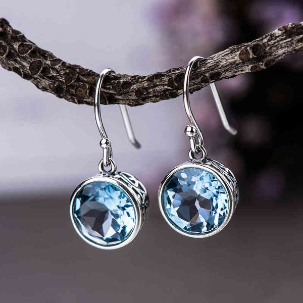 Elegant S925 silver long earrings with feminine topaz charm, personalized for a simple yet stylish look