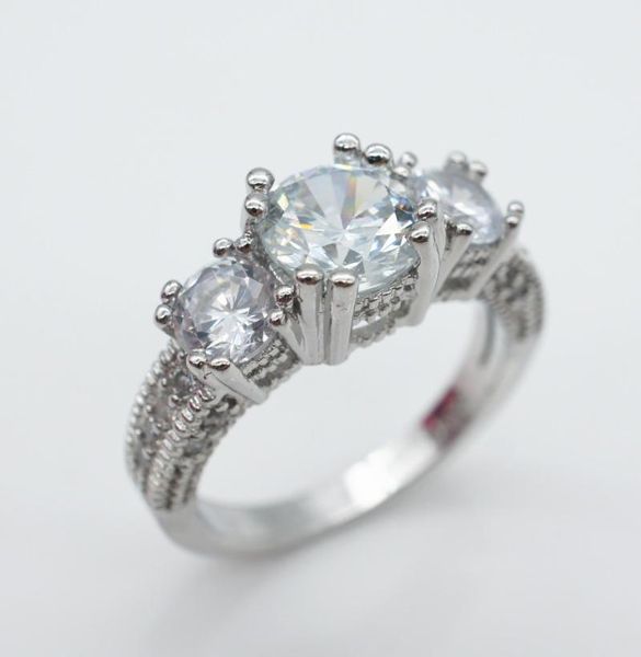 Elegant S925 sterling silver women's ring featuring three small diamonds, delicate jewelry with gemstone accents