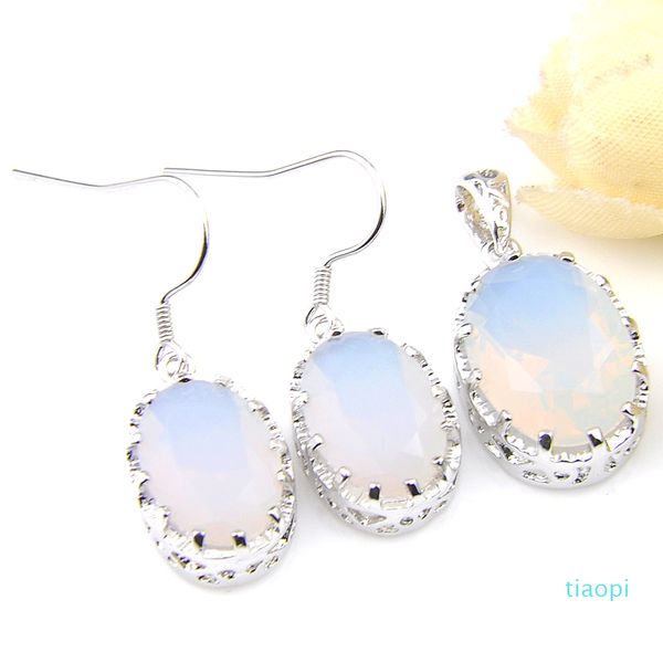 Elegant silver jewelry set featuring classic oval moonstone earrings and pendant with retro charm
