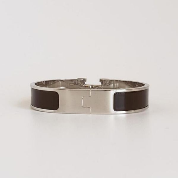 Elegant silver stainless steel bangle with gold accents, a stylish bracelet for women, perfect as wedding jewelry or gifts