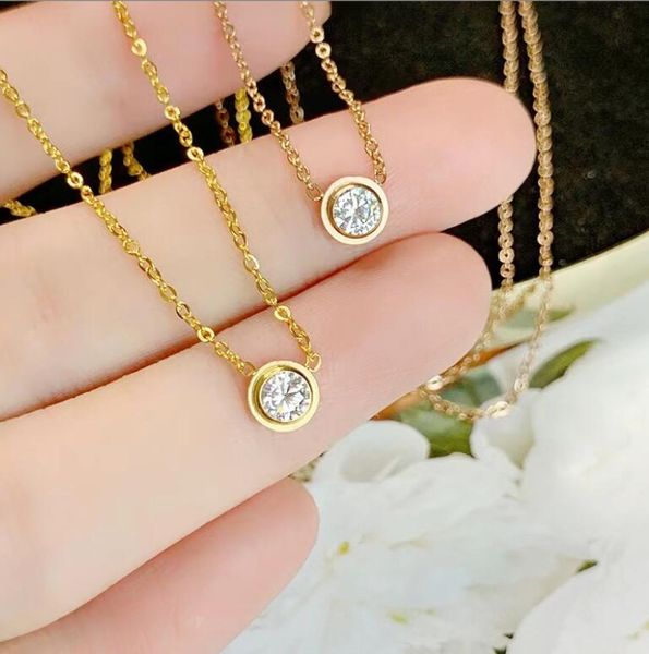 Elegant solitaire pendant for women in 925 silver with rose gold plating, featuring 5A cubic zirconia emerald and ruby stones, perfect for parties and weddings
