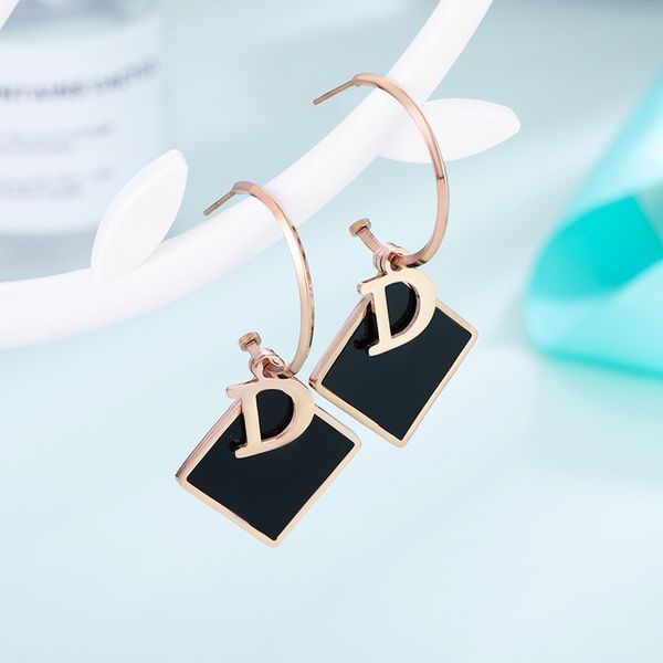 Elegant square black shell charm dangle huggie earrings for women with a classic design