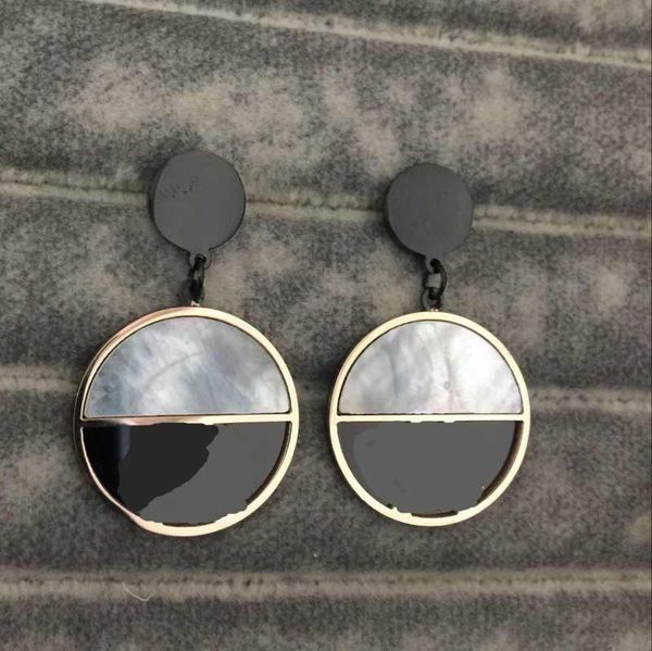 Elegant stainless steel heart-shaped stud earrings in gold, silver, and rose shades, perfect for women's parties and weddings