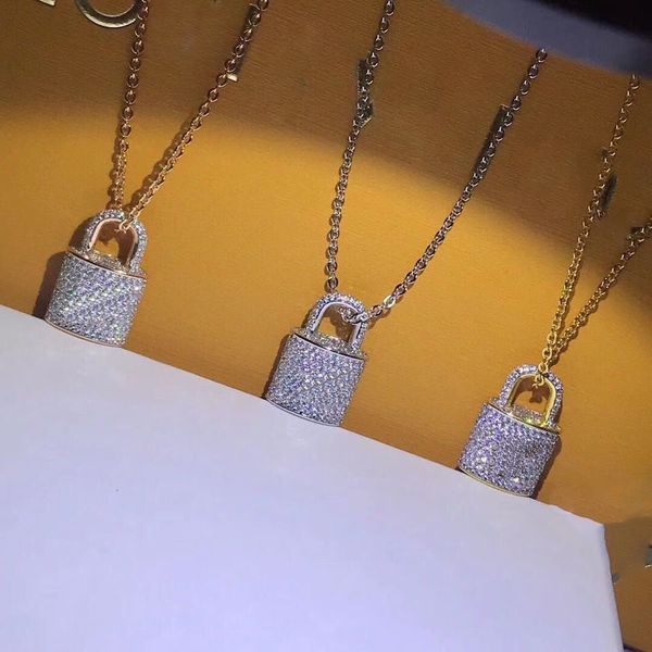 Elegant titanium steel lock pendant necklace for women, available in gold or silver with engraved letters, perfect as a romantic gift or wedding jewelry, featuring diamond accents for a luxurious d...