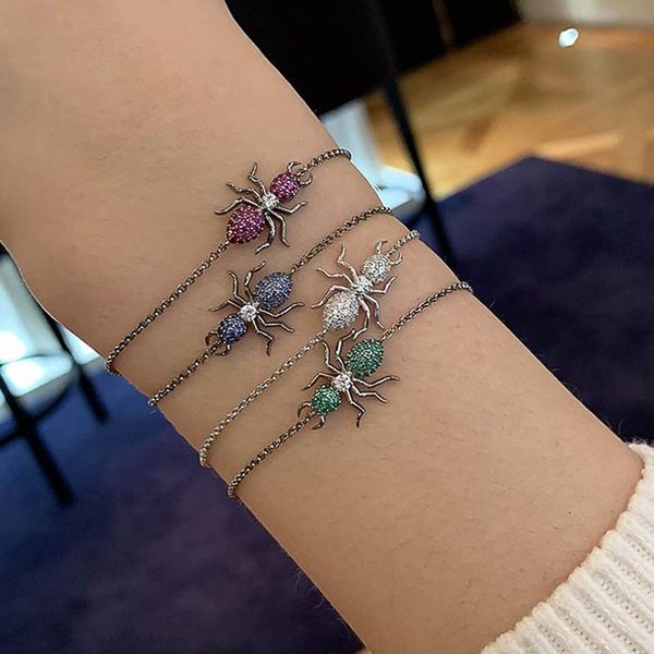 Elegant vintage-inspired charm chain bangles in white, blue, green, and red for stylish women