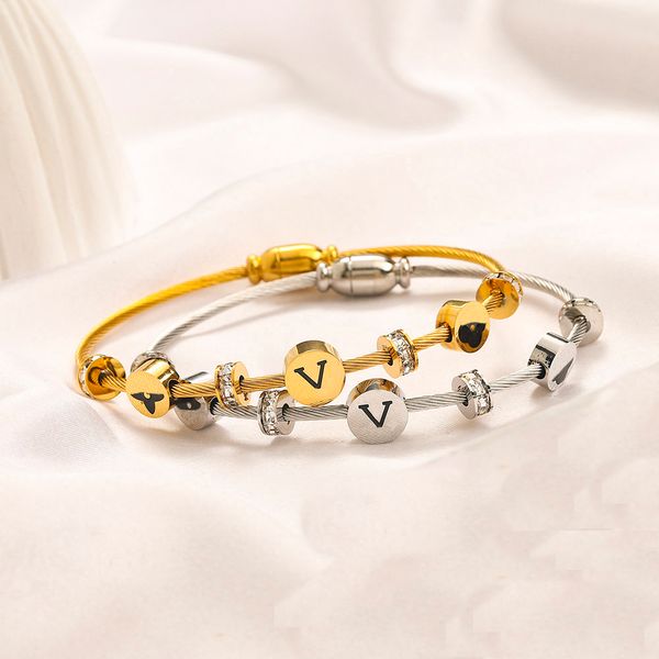 Elegant women's bangle bracelet with 18K gold plating, crystal accents, and stainless steel design, perfect as a romantic gift for her or him