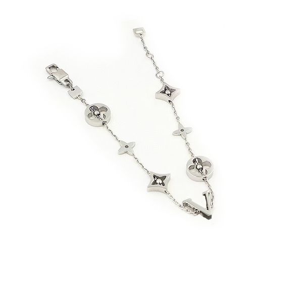 Elegant women's charm bracelet with delicate flower beads, silver-pink plating, and sparkling crystals for a stylish luxury accessory